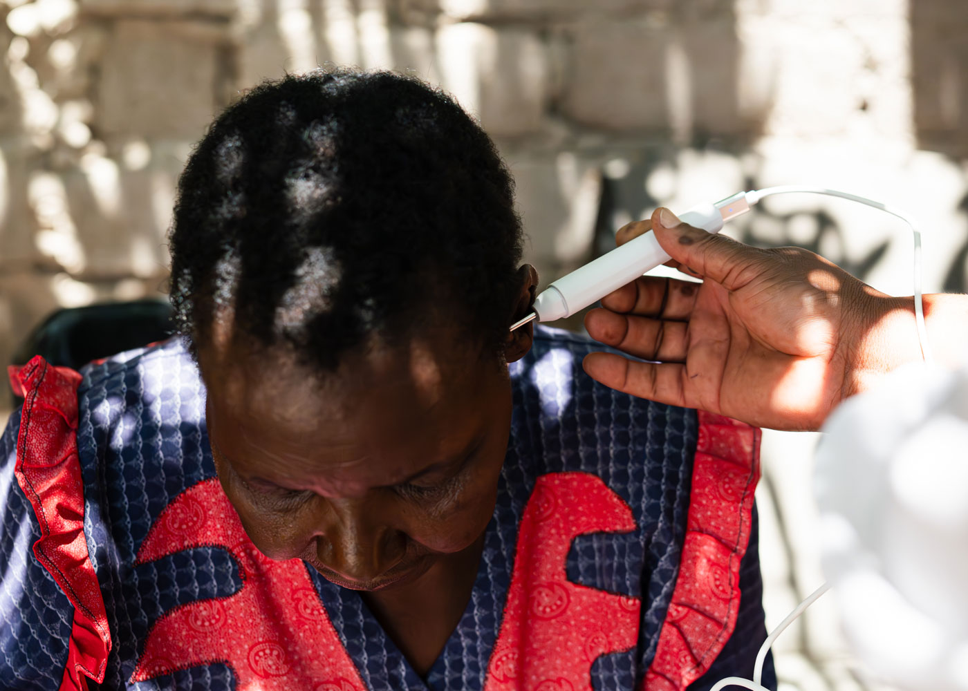 Digital otoscope inspecting patient's ear