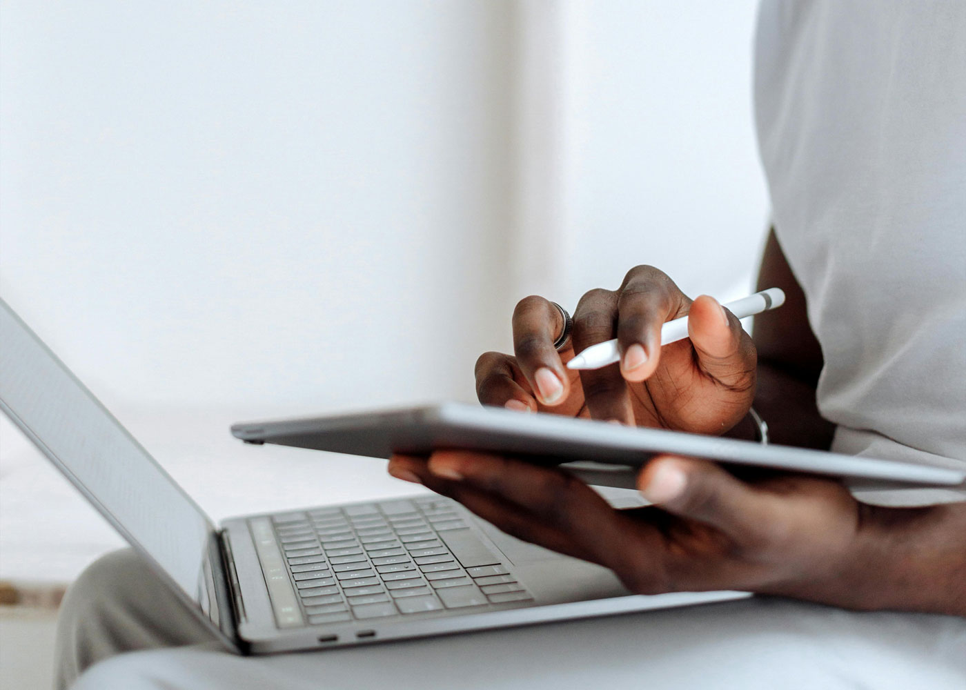 A person inputting data onto a tablet as they study